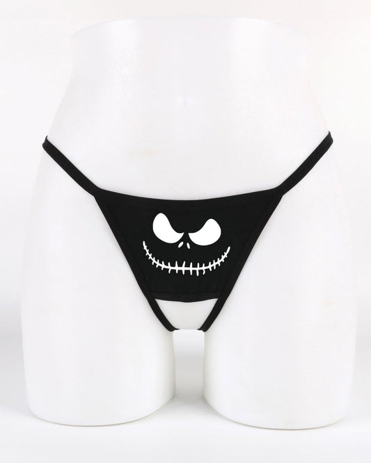 Crotchless thong panty featuring Jack Skellington–style face printed on white background — festive Halloween and Christmas lingerie.