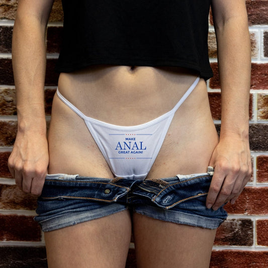White thong with “Make Anal Great Again” printed in bold text. Funny submissive panties for kink lovers with a political sense of humor.
