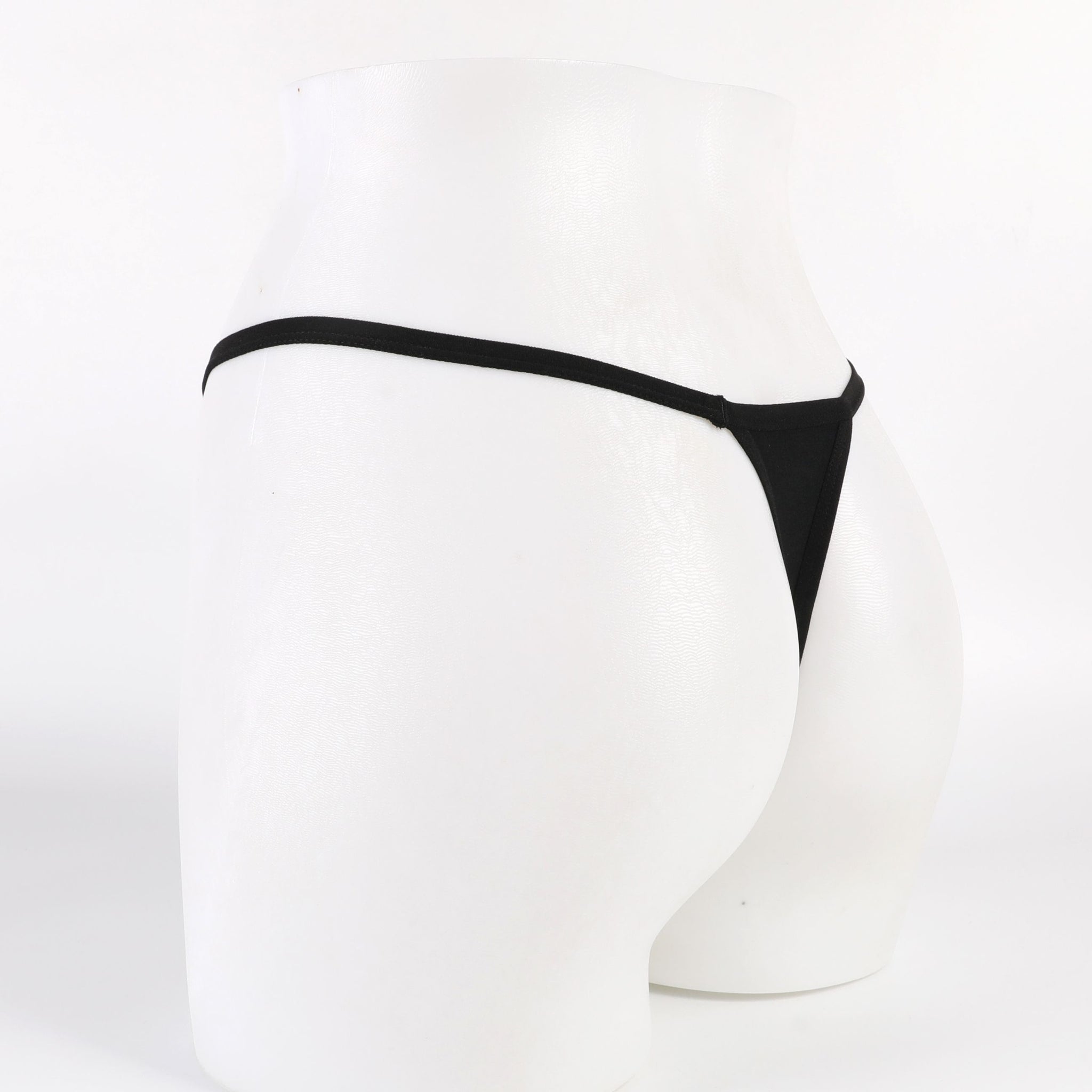 Black thong on a white mannequin against a white background