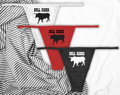 Sexy black thongs with “Bull Rider” text. Western-inspired lingerie for confident women who love to ride hard and dominate the scene.
