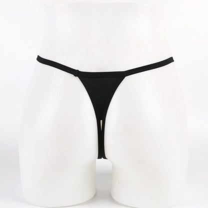 Black thong on a white mannequin against a white background