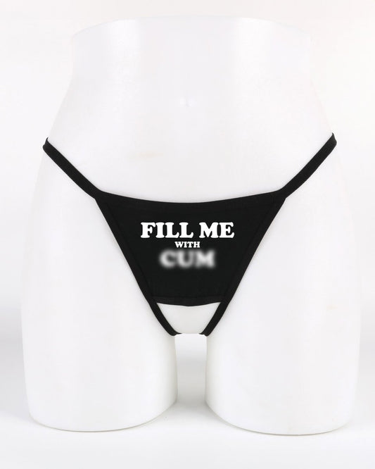 Black crotchless thong with “Fill Me With Cum” text across the front — provocative underwear for hotwife and swinger fun from Wicked Boutique®