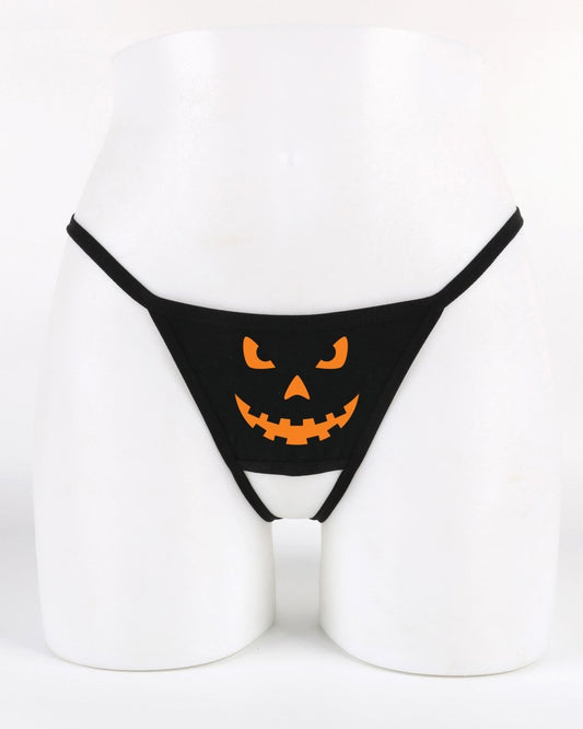 Black crotchless thong panty with Jack O’Lantern pumpkin face design on the front — spooky Halloween festive lingerie from Wicked Boutique®