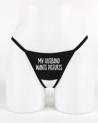 Black thong with 'My Husband Wants Pictures' text on a white background