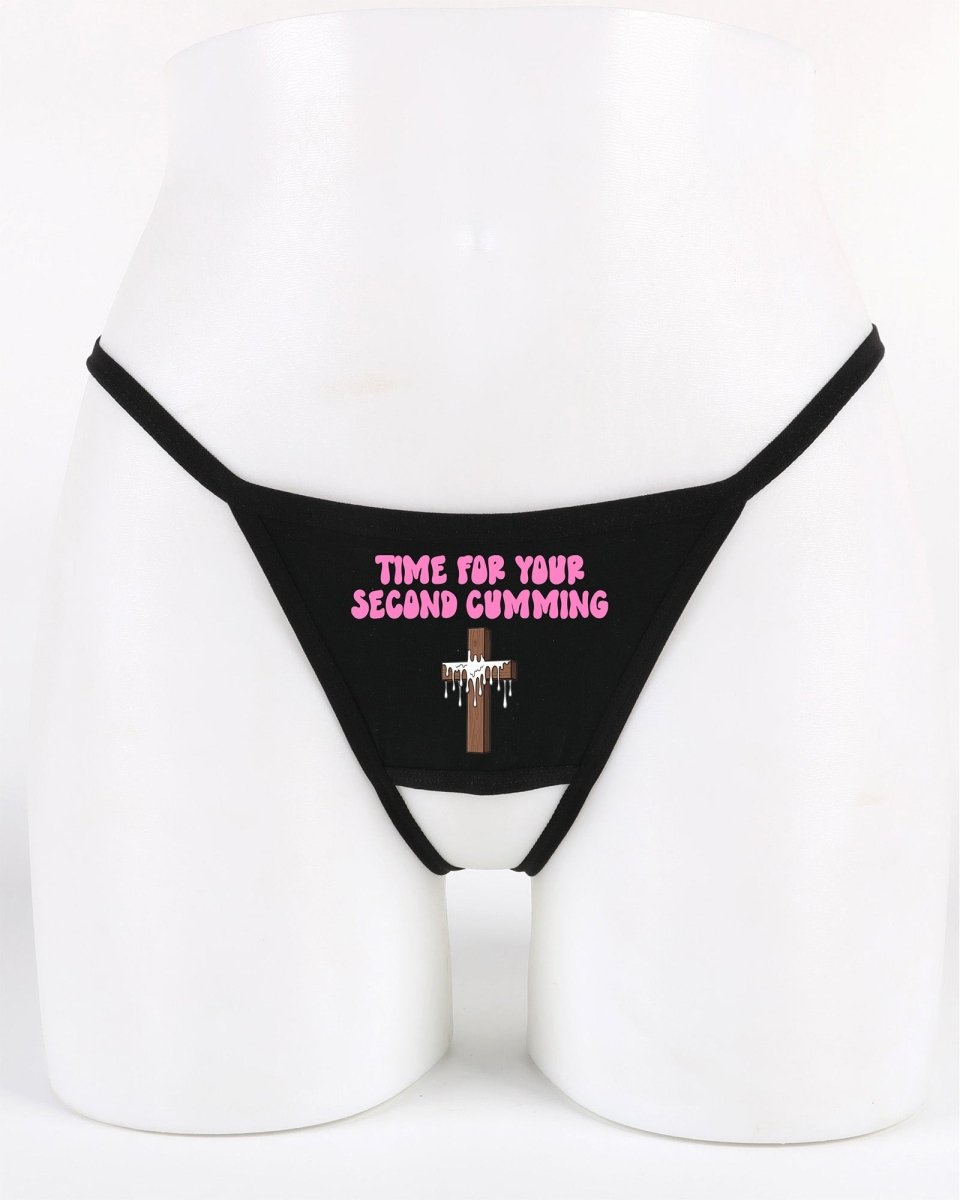 Black thong with pink text on a mannequin against a white background