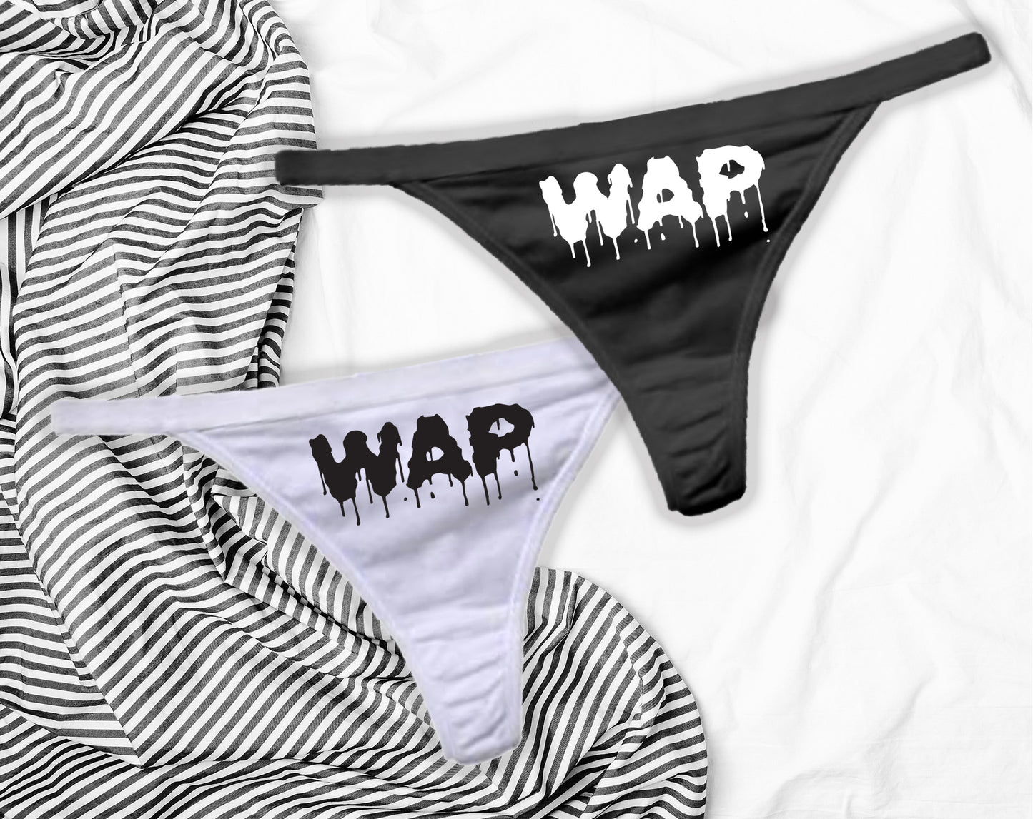 Two pairs of panties - one white and one black with WAP in dripping vinyl on the front